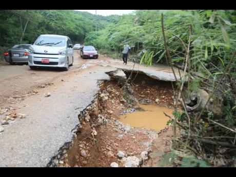 A breakaway along the Woods main road in Clarendon poses danger to unsuspecting motorists as it is more than five feet deep at its extremity. 