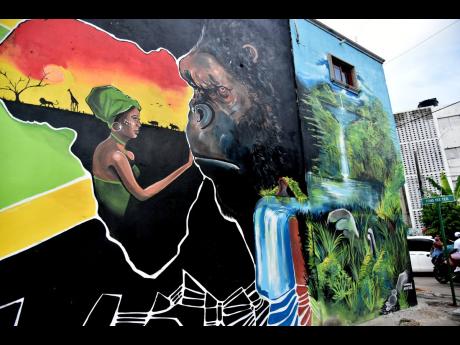 African jungle themes dominate this mural in a section of Tivoli Gardens called Rasta City. The murals are expected to help residents heal from the history of violence that has scarred the neighbourhood.