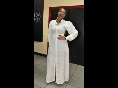 Chief Executive Officer of United Way Stephannie Coy illuminated the premiere in this long, sleek, white shirtdress.
