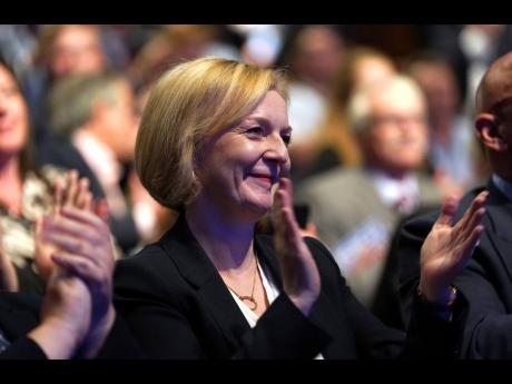 United Kingdom Prime Minister Liz Truss applauds at the Conservative Party annual conference at the International Convention Centre in Birmingham, England, on Monday, October 3.