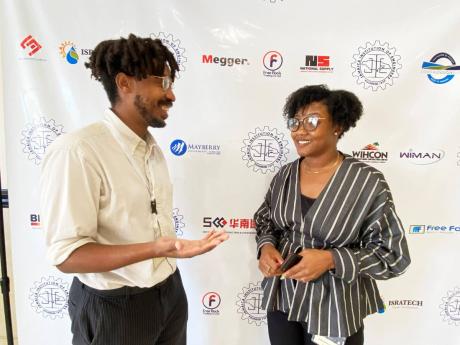 Jhordan Channer (left) and Dorraine Duncan, co-founders of Island City Lab, in discussion during the Jamaica Institution of Engineers’ Conference at The Jamaica Pegasus hotel on Tuesday.