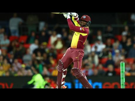 West Indies batsman Kyle Mayers plays a lofted back-foot drive for six during his innings of 37 in a losing effort against Australia in the first of a two-match T20 International series at the Carrara Stadium in Australia yesterday. 