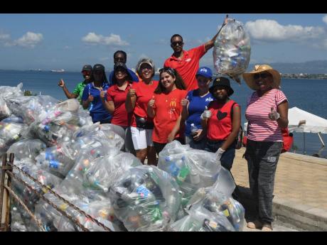 The JMMB Group team together with family and friends joined forces with the Port Royal Marine Laboratory and Biodiversity Centre to clean up a section of the Palisadoes coastline on September 17.