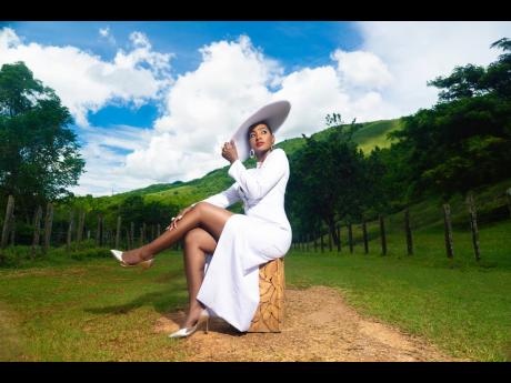 Right: The sophisticated 40th celebrations included the incorporation of a white skirt set with hat, photographed by Adrian Smith. ‘The white represents the favour that God continues to extend to me every single day. The clean canvas that He gives us eve