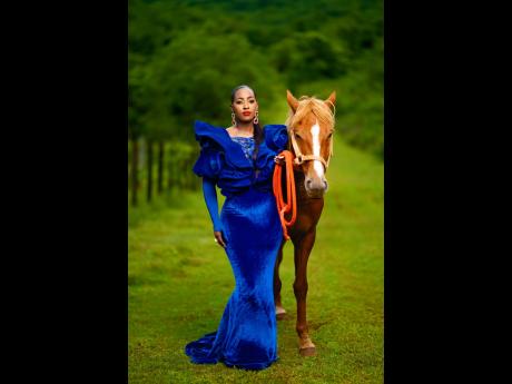 She’s royal: D’Aguilar and horse Spirit are giving regal flair as she stands boldly and proudly in the stunning mermaid cut dress to commemorate her 40th birthday.