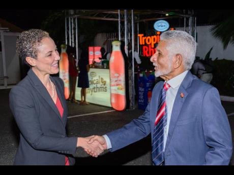 Deryck Murray (right), high commissioner of the Republic of Trinidad and Tobago to Jamaica, greets Kamina Johnson Smith, minister of foreign affairs and foreign trade.