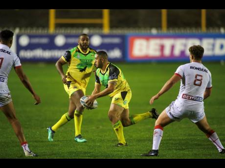 Jamaica’s Reggae Warriors (in gold) in action against England Knights in a rugby league international friendly match at Castleford in Yorkshire, England on Friday, October 15, 2021.