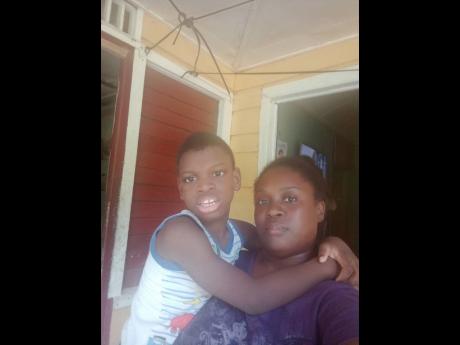 Nine-year-old Elijah Street at home with his mother Kameale Ellis.