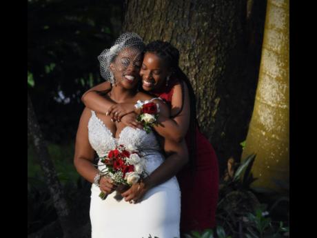 The bride, Dr Deon Wilks (left), and her sister and maid-of-honour, newly-wed Dana-Marie Oladipo.