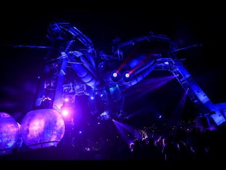 Metamorphosis’ at Arcadia features a light show involving a giant spider at the Glastonbury music festival at Worthy Farm, in Somerset, England, June 24, 2016. The Arcadia Spectacular event at a 15,000-capacity site at Ras Bu Fontas close to Doha’s new