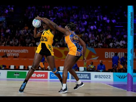Jamaica’s Shimona Nelson (left) and Barbados’ Faye Agard battle for the ball during the Netball Pool A match between Jamaica and Barbados at the Commonwealth Games  in Birmingham, England on August 1.