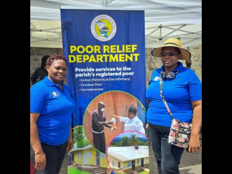 Ann-Marie Thomas (left), acting inspector of the poor for Clarendon, and Christina Simpson, poor relief officer, mark World Homeless Day at the old police station in May Pen.