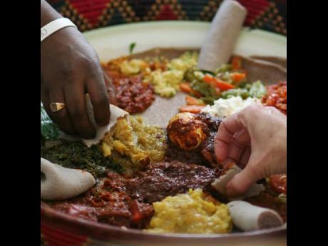 Eating Ethiopian-style means rethinking many assumptions you might have about dinnertime, for many that means eschewing cutlery and eating with your hands.