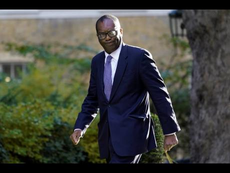 Britain's Chancellor of the Exchequer Kwasi Kwarteng. British media says Treasury chief Kwasi Kwarteng has left the government, ahead of an announcement by Prime Minister Liz Truss on changes to an economic package that sparked market turmoil.