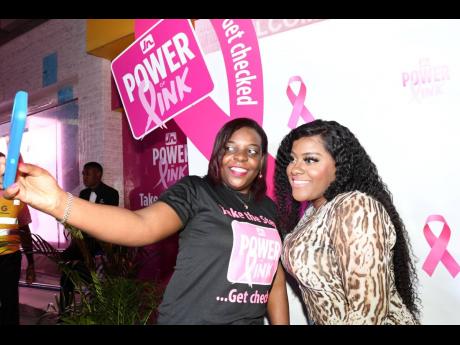 We snapped Roshene Wilson (left), creative traffic officer in the JN Group marketing department, taking a selfie with recording artiste Etana after her performance at the JN Group Power of Pink Pop-Up Session.