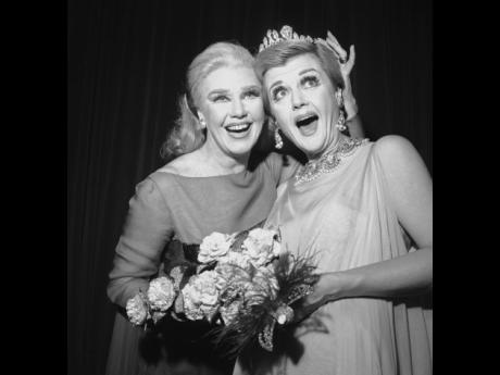 Ginger Rogers (left), star of the Broadway musical ‘Hello, Dolly’ crowns Angela Lansbury, who starred in ‘Mame’, with the crown of Miss Ziegfeld 1967 on December 2, 1966, at the 29th Ziegfeld charity ball. Rogers was the 1966 Miss Ziegfeld. 