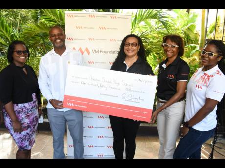Principal of Charlie Smith High School Christopher Wright (second left) is delighted to receive a donation of $150,000 from the VM Group, through a partnership with the VM Foundation and the VM Group Operations Unit in their Unit for a Cause initiative. Sh