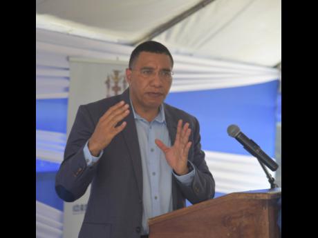 Prime Minister Andrew Holness speaking at the groundbreaking ceremony for the new Little London Police Station in Westmoreland on Thursday, April 7.