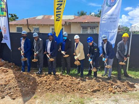 National Security Minister Dr Horace Chang (fourth right) and Police Commissioner Major General Antony Anderson (third right), along with Custos Rev Hartley Perrin (second left) and municipal representatives, break ground for the construction of the new Fr