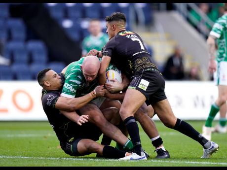 Ireland’s George King (centre) is tackled by Jamaica’s Kieran Rush (right) and Aaron Jones-Bishop  during the Rugby League World Cup Group C match between Ireland and Jamaica at Headingley Stadium, Leeds, England on Sunday October 16.
