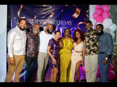 It was a family affair! Birthday girl Nadine Spence (fourth right) is flanked by her family (from left): Nathaniel, Orville (husband), Stephan, Gabrielle, Nahdira, Andre and Najeeb Spence.
