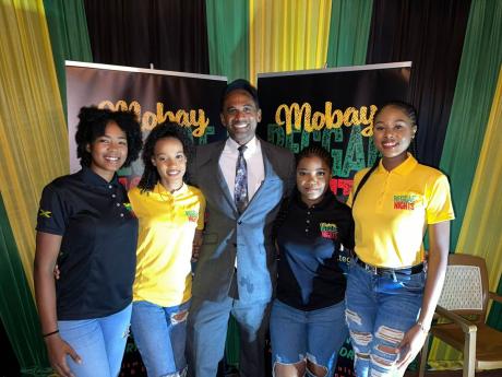 Dr Carey Wallace (centre), executive director at the Tourism Enhancement Fund, stands with members of the MoBay Reggae Nights promotional team at the launch of the monthly event held at Pier One Restaurant in Montego Bay. From left are Christina Samuels, C