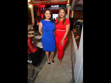 Carolina Harrera Dominguez (left), public relations manager of Huawei Central America and the Caribbean, and Joeshaida Garcia, legal manager for Huawei Panama, Jamaica and Trinidad, upped the style quotient in red and blue.