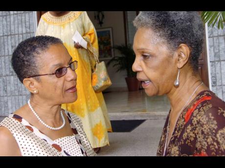 Fae Ellington (left) chats with fellow broadcaster and great friend Leonie Forbes at a book launch at Jamaica House on June 1, 2008.
