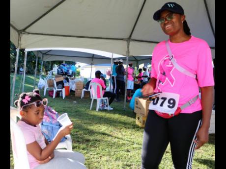 Seven-year-old Lauryn Jones with her mother Latania Morrison after completing the Rayz for Life 5K Run, organised by the Jamaica Energy Partners Group.