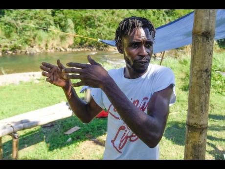 Kemar Failey, a resident of Comfort Castle, wants a five-year ban on fishing in the community’s river so that the crayfish population can be replenished. 