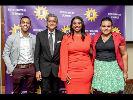 Obstetricians Dr Leo Walker (left) and Dr Astrid Batchelor (third left), pose with emcee, Cedric McDonald (second left) and moderator and neprhologist, Dr Lori-Ann Fisher (right) after making their presentations at the lupus symposium. 