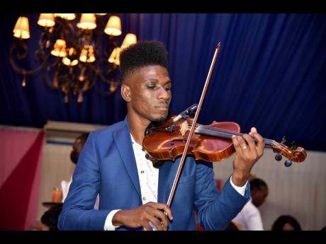 Kemar’s journey with the violin started while attending the prominent all-boys high school, Kingston College.