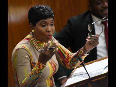 Denise Daley, member of parliament for St Catherine Eastern, gestures during her State of the Constituency Debate address in Gordon House on Tuesday.