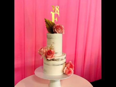 The elegant two-tiered magazine anniversary and Live with Flair luncheon cake was a sweet showstopper at the event.