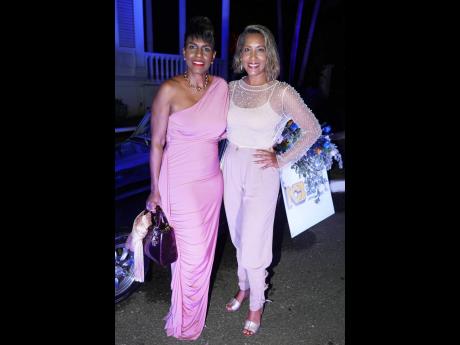 Both pretty in pink, NCB’s Head of Private Banking ,Audrey McIntosh (left) and JFDF Festival Director, Nasma Chin, share beautiful smiles with the camera at Vintage last Thursday.