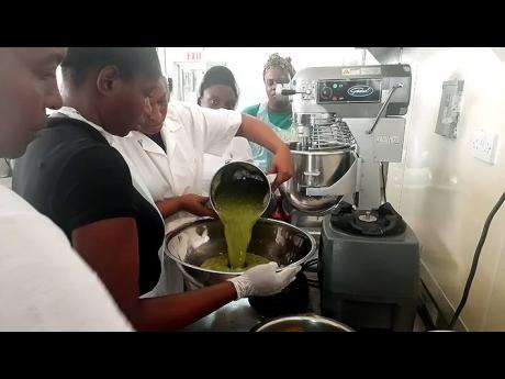  The Central Jamaica Social Development Initiative Youth Entrepreneurship participants are engaged in a  session on food processing.