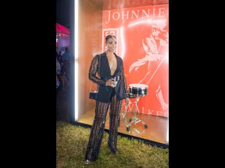 Fierce and fabulous Latesha Ramcharan-Mullings looked stunning in this sheer accent-tailored suit paired to perfection with black Valentino heels and a Prada bag to match.