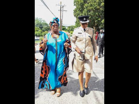 Dr Asha Mwendo (left), president of the National Neighbourhood Watch Movement, and Senior Superintendent Charmaine Shand are seen at Andrews Memorial Seventh-day Adventist Church where a special service commemorating the 35th year of the movement was hoste