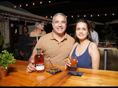 Vivek and Pooja Chatani are all smiles while enjoying their St-Rémy Signature cocktails.