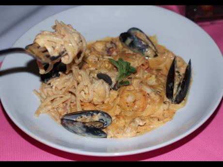 Trio’s creamy Tuscan seafood medley with linguine.
