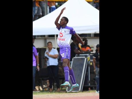 
Kingston College’s Dujuan Richards celebrates the third goal of his hat-trick against Mona High School during their ISSA/Digicel Manning Cup quarter-final fixture at the Stadium East Field yesterday.