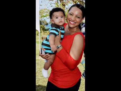 In this 2013 Gleaner photo, Amoi Leon poses with her infant son Gabriel King. The mother is challenging a court order for the police to access information from her phone that may be helpful in Gabriel’s murder investigation. 