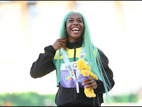 World Champion in the women's 100 metres Shelly-Ann Fraser-Pryce takes the podium for the medal ceremony at the World Athletics Championships inside Hayward Field in Eugene, Oregon on Monday, July 18. 