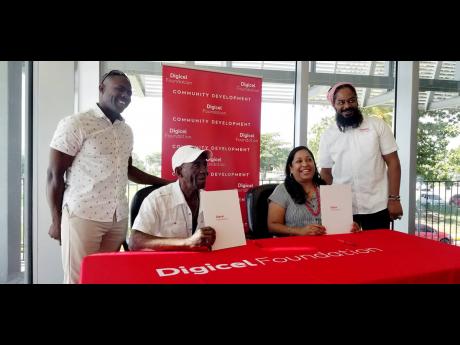 From left: Vice-president of the Old Folly Youth Club Alvin Gibson, president of the Old Folly Youth Club George Brown, Digicel Foundation CEO Charmaine Daniels, and Community Development Manager Digicel Foundation Miquel ‘Steppa’ Williams pose after s