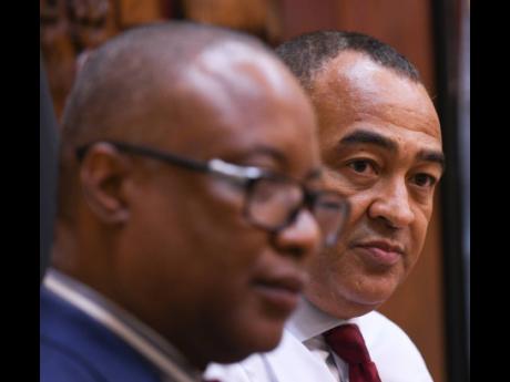 Permanent Secretary Dunstan Bryan (foreground) and Health Minister Dr Christopher Tufton have been at the forefront of Jamaica’s billion-dollar spend on COVID-19 response.