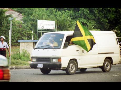 Jubilant Jamaicans celebrate the Reggae Boyz’s triumphant qualification to the 1998 FIFA World Cup on November 16, 1997.