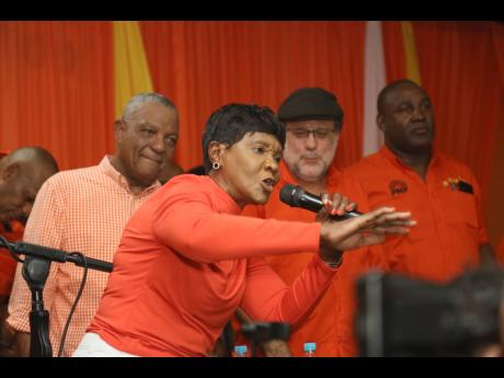 St Catherine Member of Parliament Denise Daley addresses Comrades during the Clarendon North constituency conference at Claude McKay High in James Hill on Sunday. In the background (from left) are Clarendon Northern caretaker Horace Dalley, People’s Nati