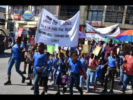 Students from schools in Westmoreland march against abuse and violence being committed against minors as part of a campaign led by the Child Protection and Family Services Agency. The march took place in Savanna-la-Mar on Friday.