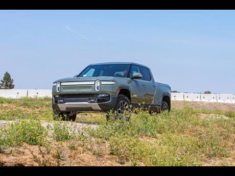 The 2022 Rivian R1T. It is an all-electric pickup truck with an EPA-estimated range of 314 miles in its initial configuration.