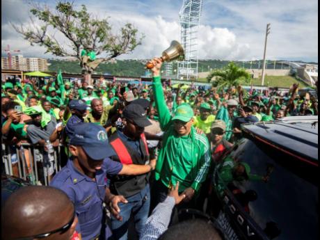 In this 2019 photo Andrew Holness arrives at the National Arena with a bell for the Jamaica Labour Party Annual Conference held on November 24.